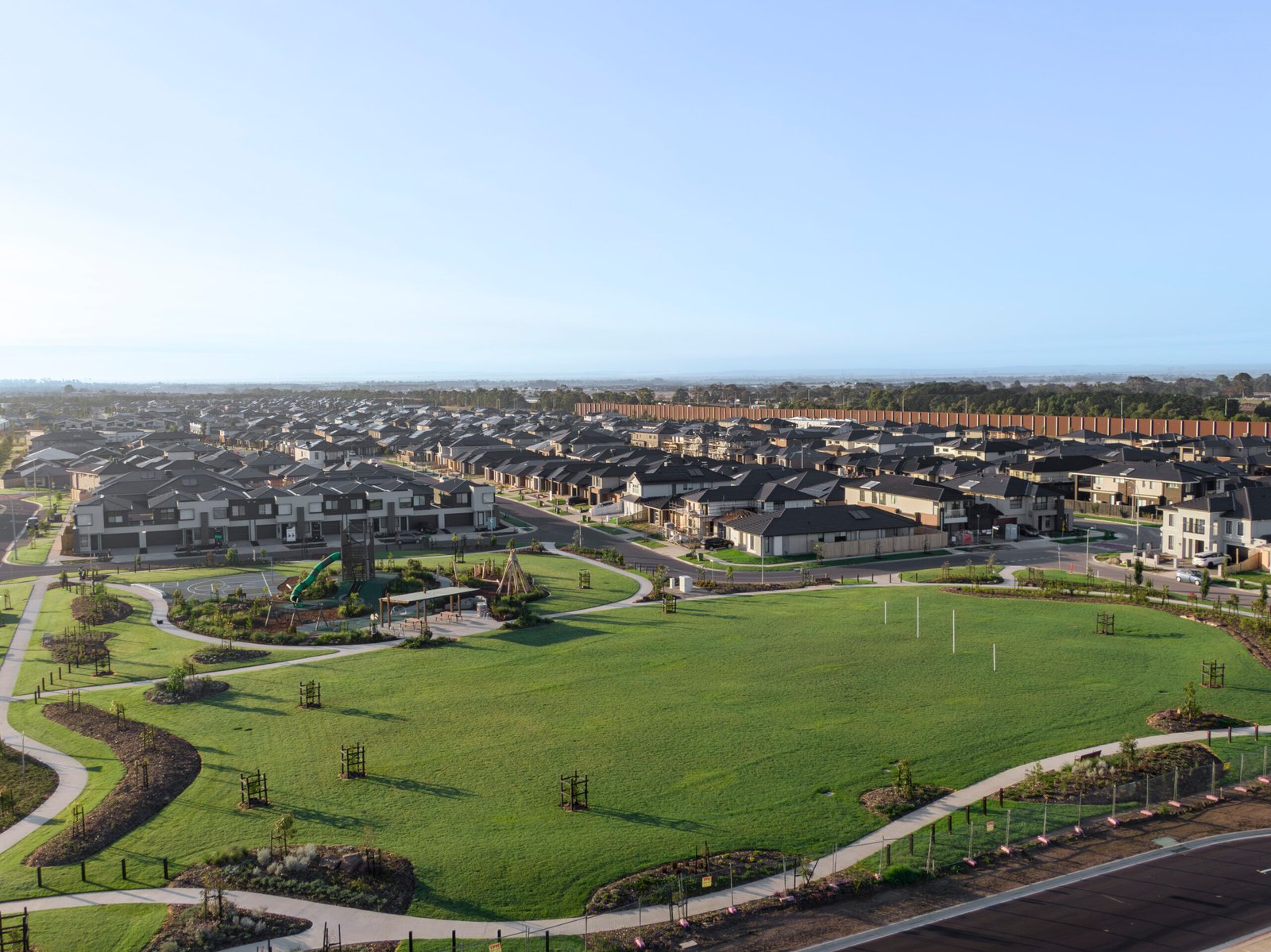 A modern and affordable home set within a picturesque landscape in Melbourne's West and South East. The image showcases a spacious front yard and contemporary architecture, reflecting the value and charm of affordable living in family-friendly communities.